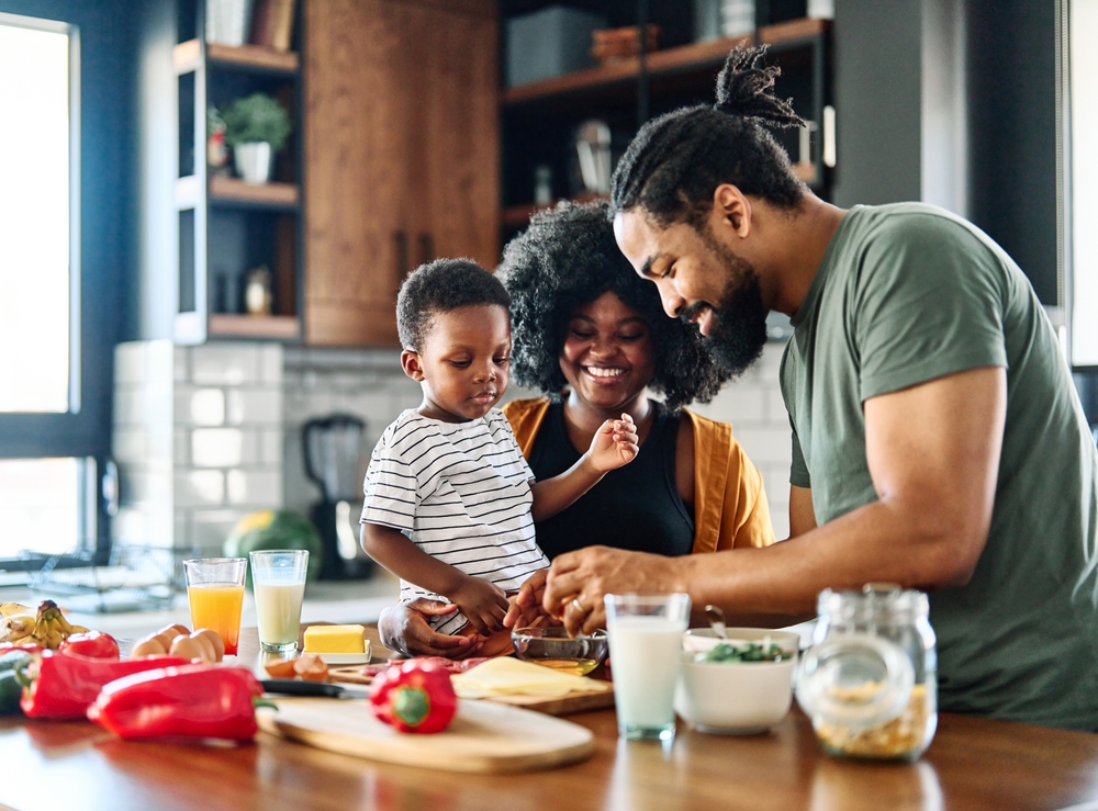 A family smiling together, protected by health insurance coverage